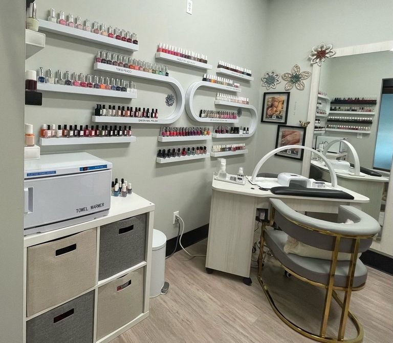 The manicure station at Soraya's Nail Studio, with the polish collection, towel warmer and gold client chair